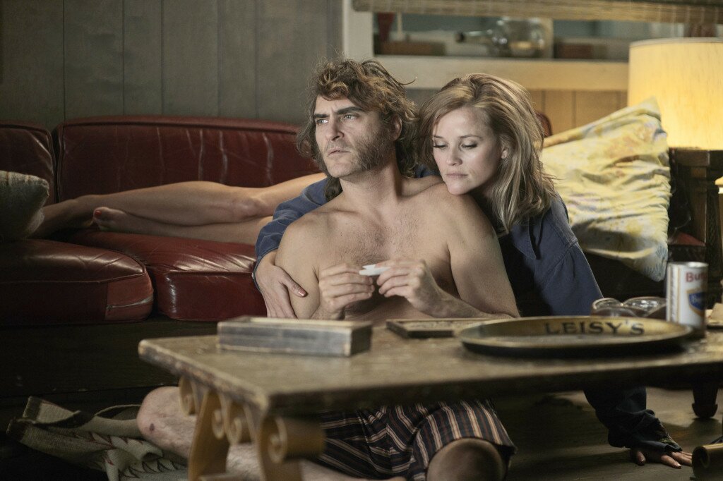 (L-r) JOAQUIN PHOENIX as Larry "Doc" Sportello and REESE WITHERSPOON as Deputy D.A. Penny Kimball in the movie INHERENT VICE, directed by Paul Thomas Anderson. Photo Credit: Wilson Webb